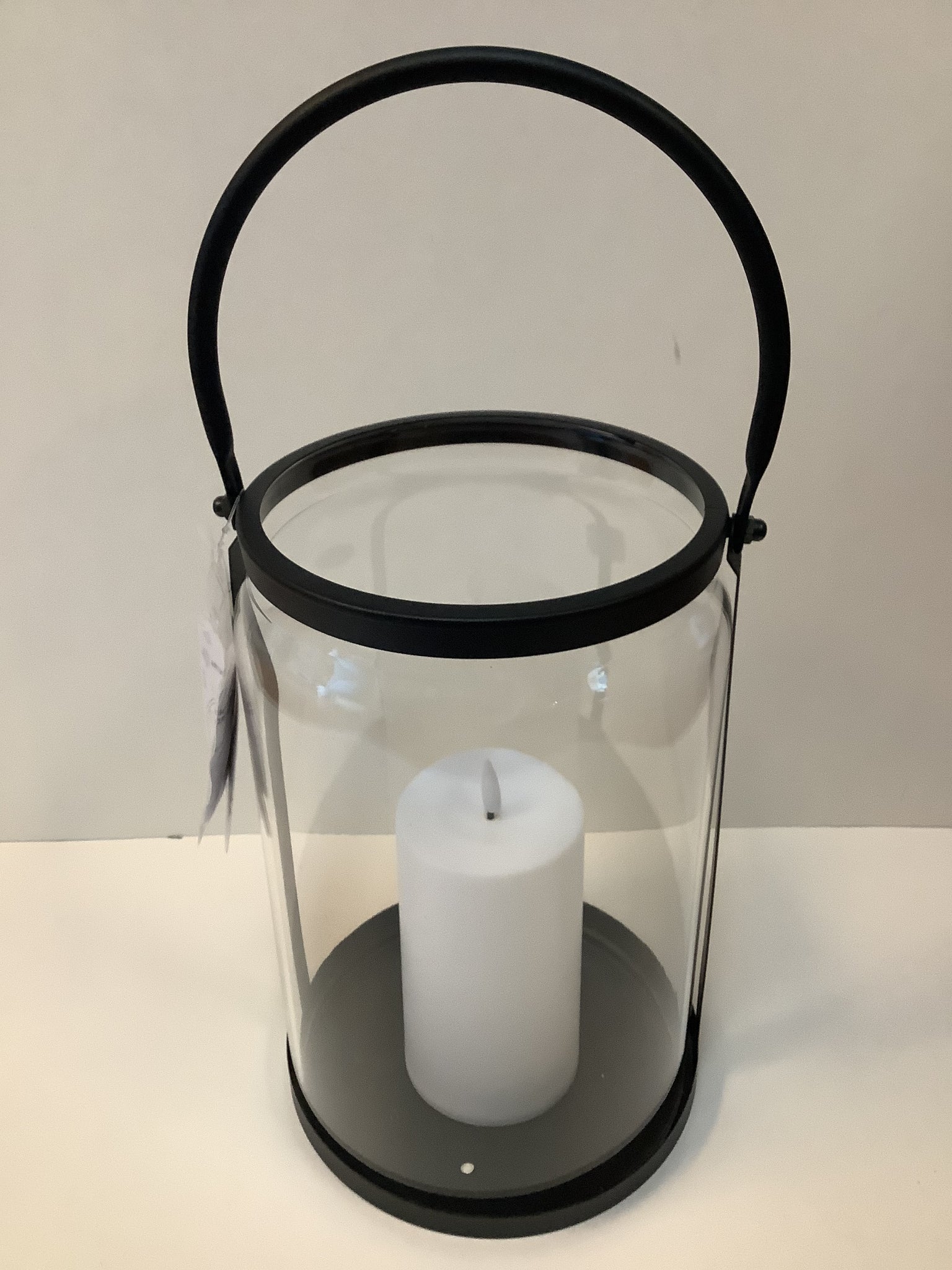 Glass lantern with candle