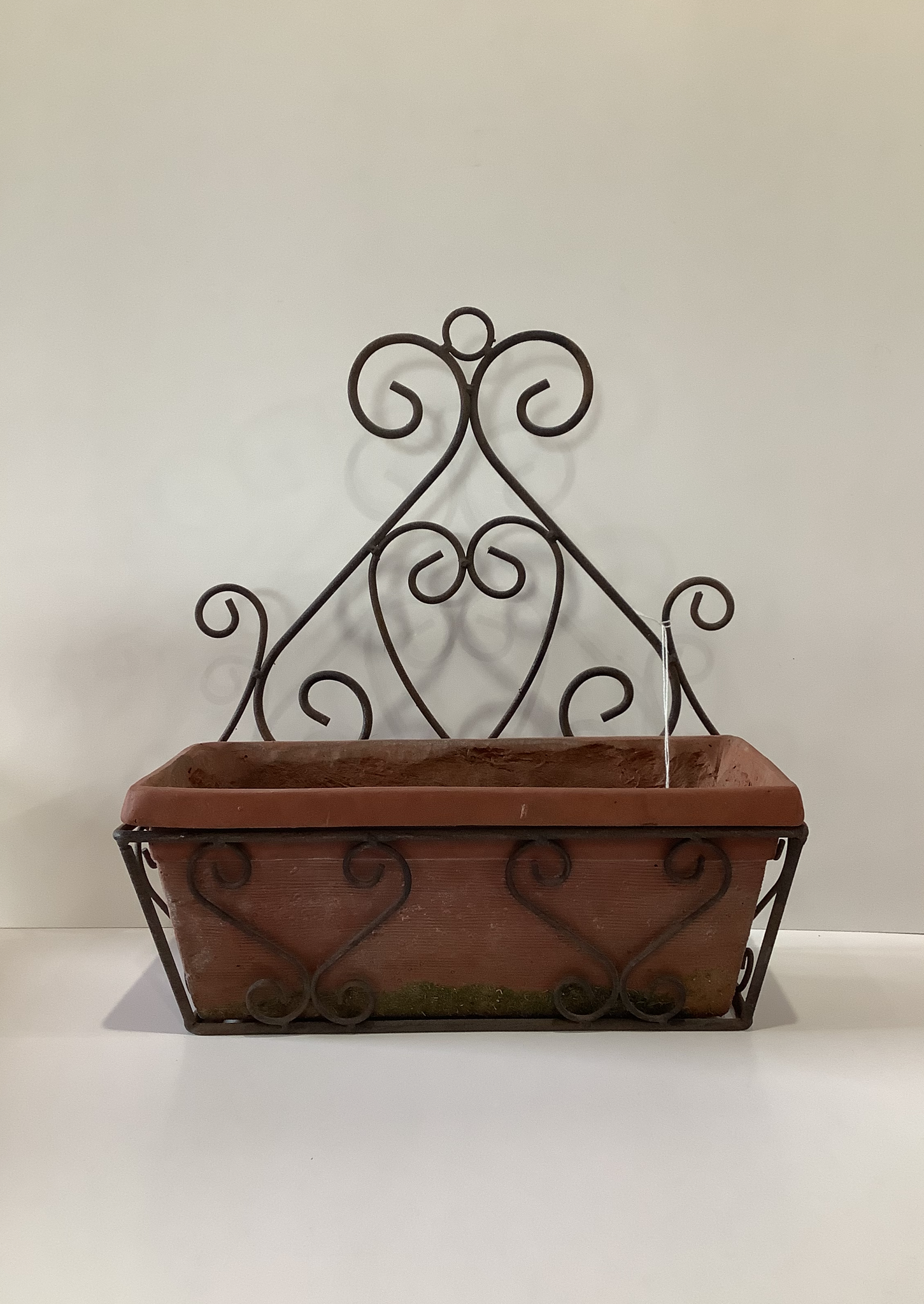 Metal and clay planter