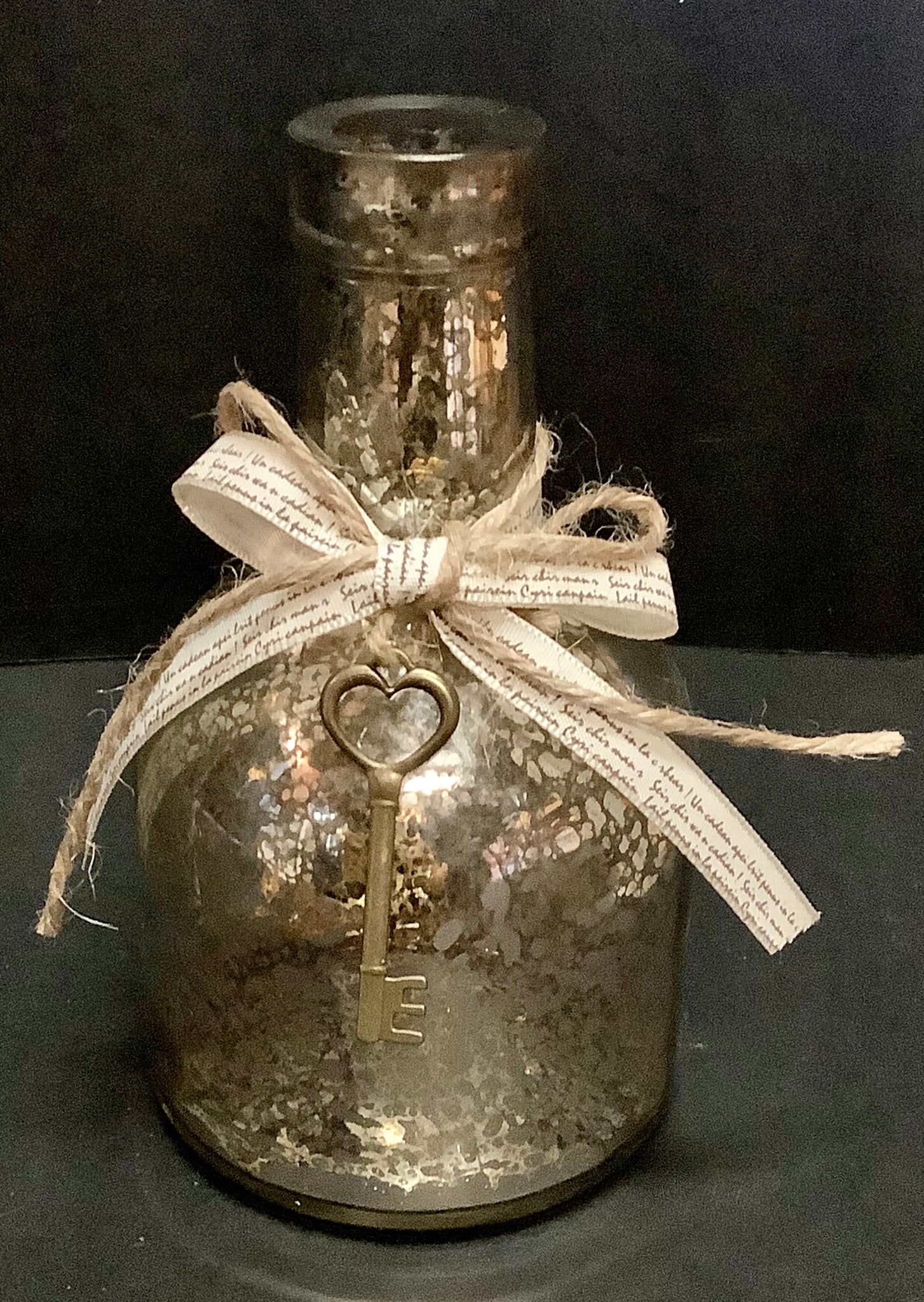 Mercury glass bottle with key