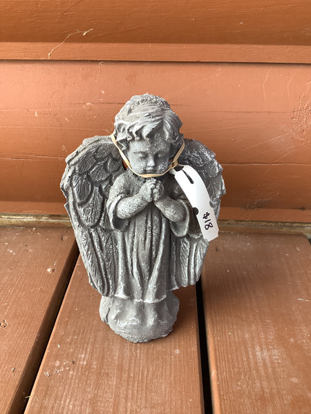 Concrete small praying angel